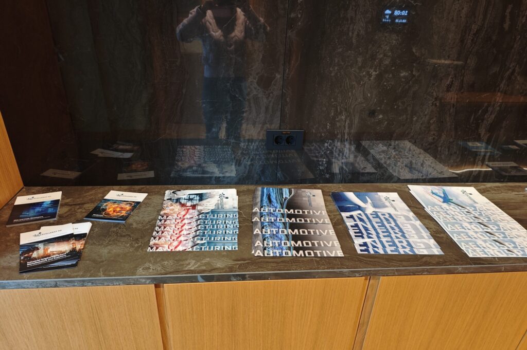 Photo of EXCELLERAT P2 flyers displayed at the venue.