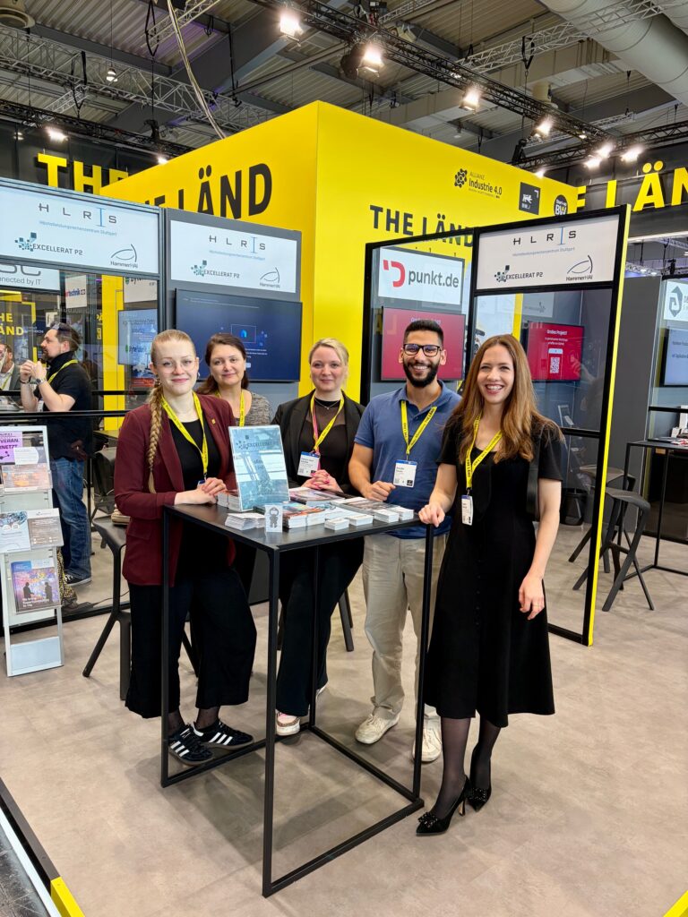 Group photo of booth staff at the Hannover Messe